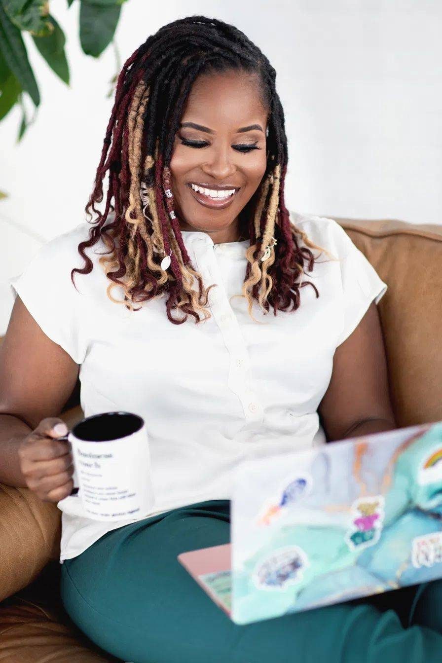 Yvette Howard, LCSW, smiling in a black T-shirt